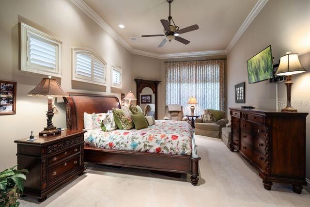 a room with lots of books and a large window