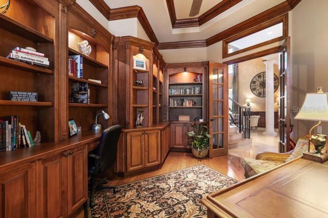 a view of entryway livingroom and hall with wooden floor