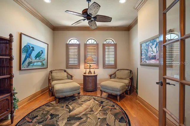 a dining room with furniture and wooden floor
