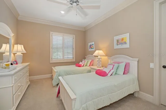 a room with furniture pool table and windows