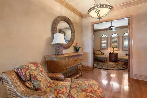 a dining room with furniture and wooden floor