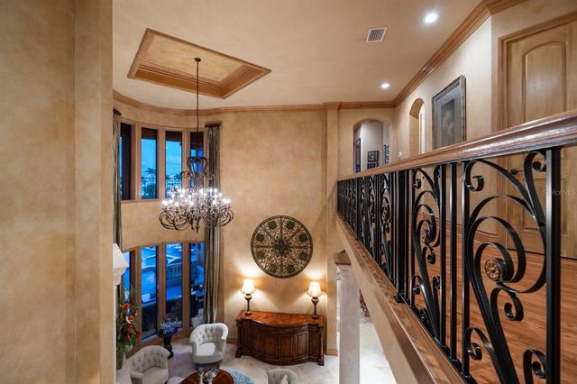 an aerial view of a house with swimming pool garden and patio