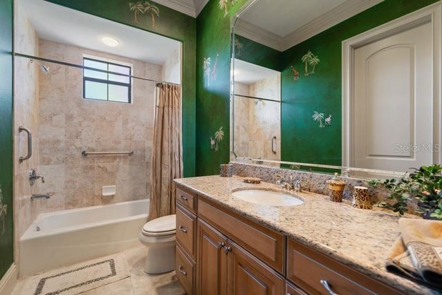 an aerial view of a house with swimming pool patio and outdoor seating