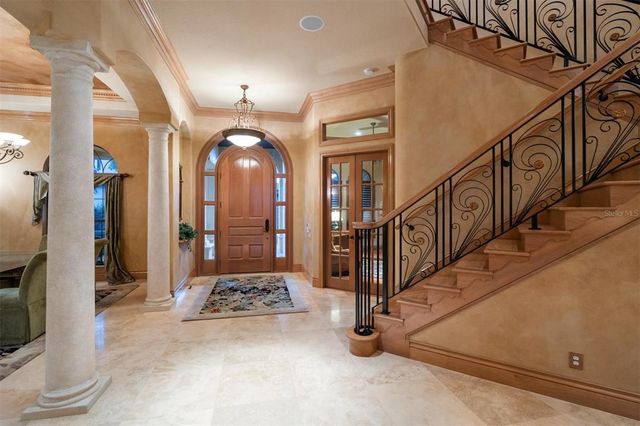a view of a hallway with paintings on the wall
