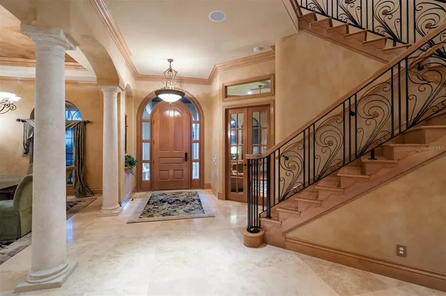a view of a hallway with paintings on the wall