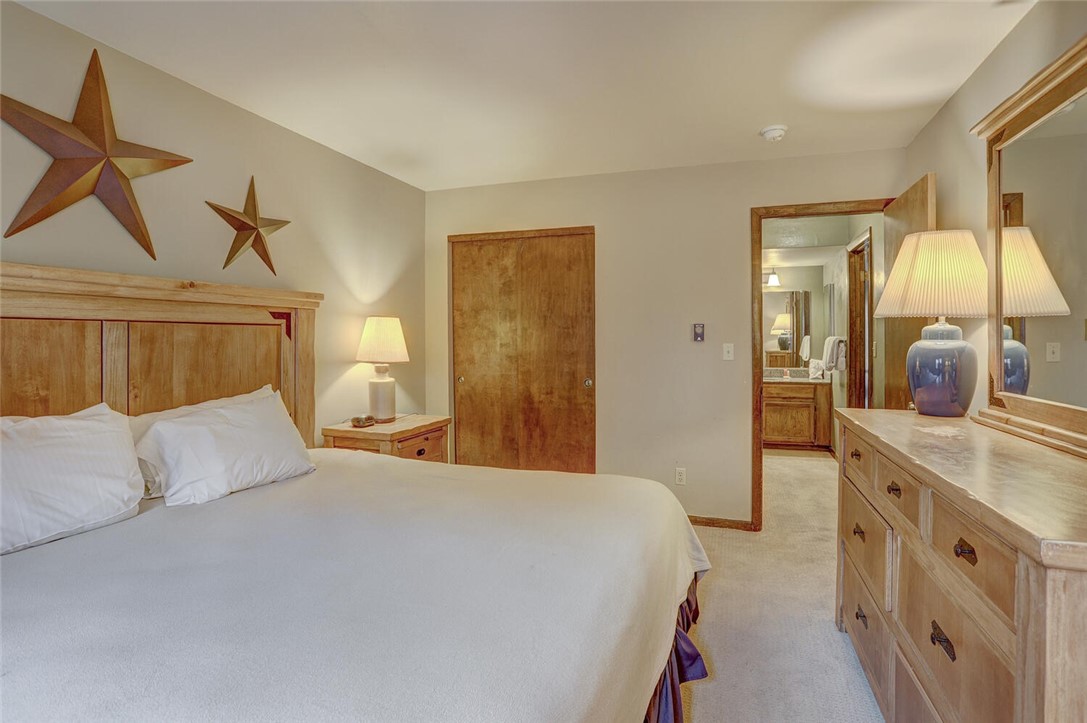 325 Four Oclock Road, Unit C203 Breckenridge, CO 80424 - Photo 7 of 35 Master bedroom with king size bed and attached bath.