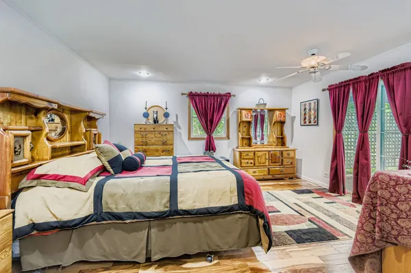 a bedroom with a bed and window