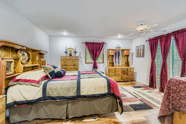 a bedroom with a bed and window