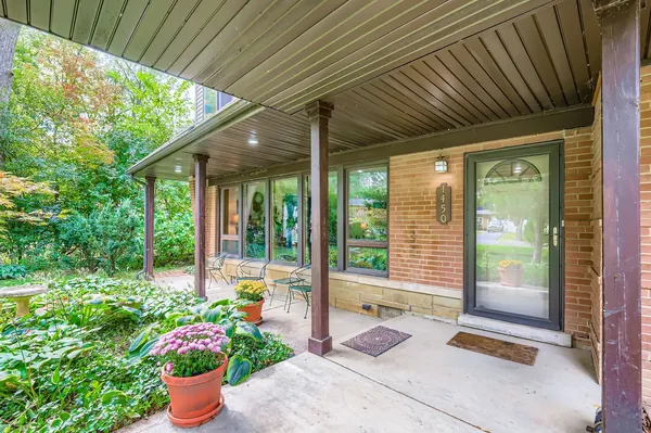 a front view of a house with a porch