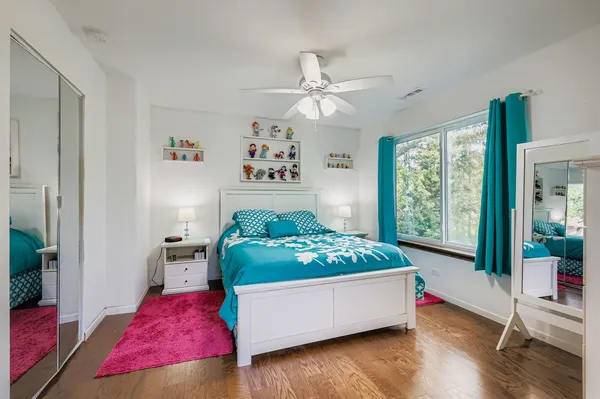 a bed room with a bed and a window