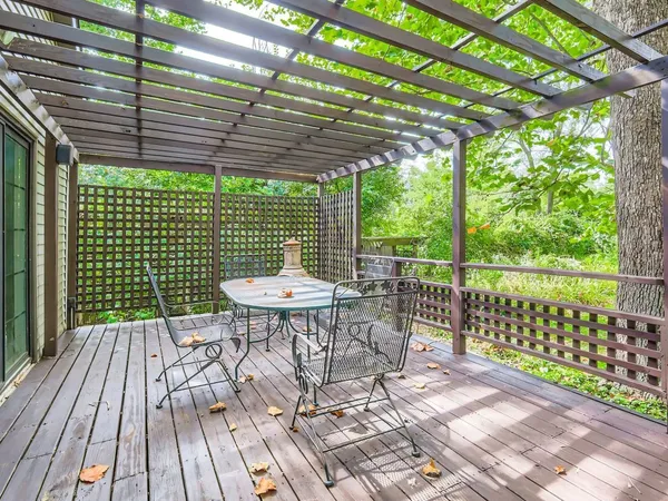 a view of a patio with a table and chairs