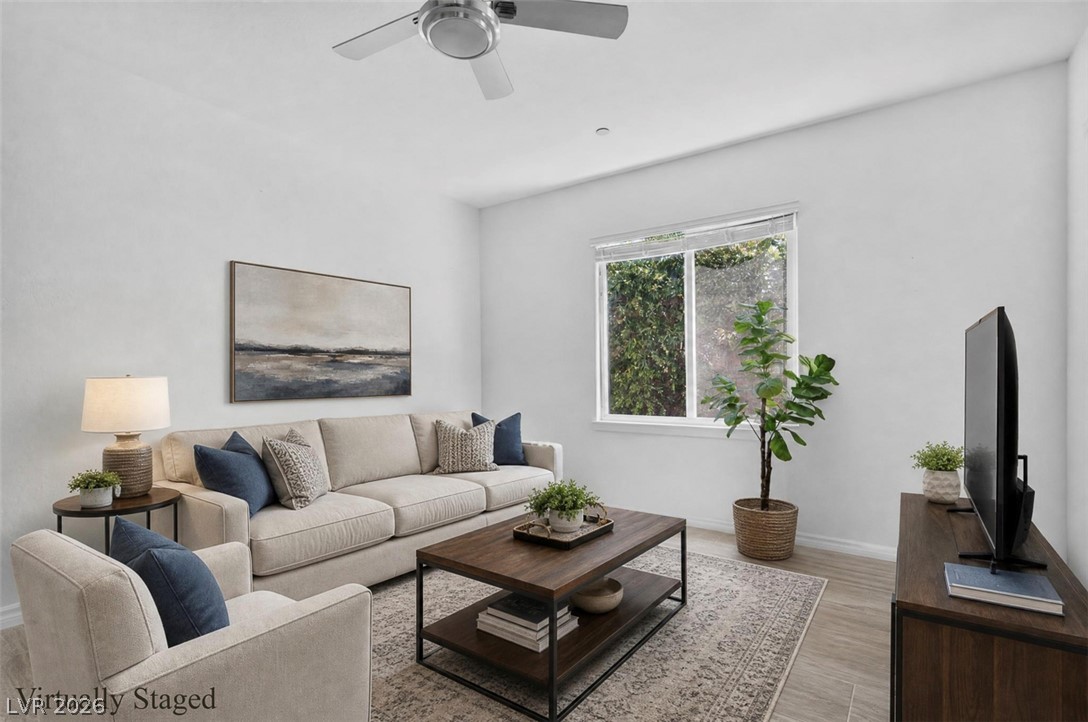 1824 Redland Ridge Street Henderson, NV 89002 - Photo 23 of 69 A living room showcasing high ceilings and durable tile flooring.