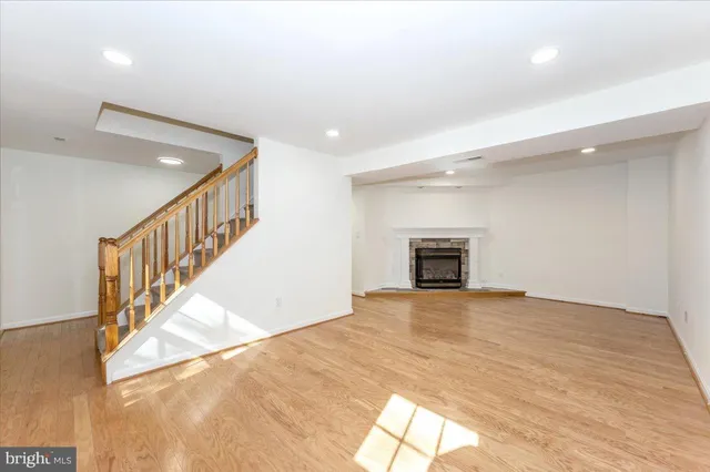a view of empty room with a fireplace