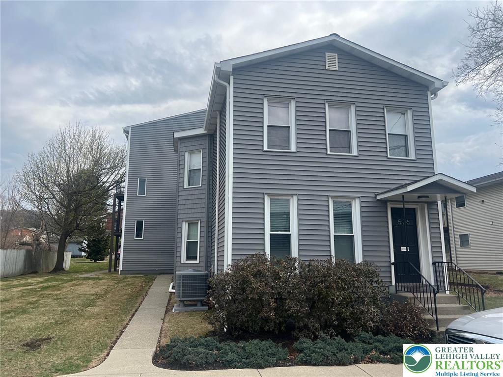 526 Broad Street, Unit 1 Emmaus, PA 18049 - Photo 1 of 15 a front view of a house with garden