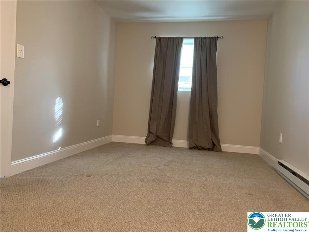 526 Broad Street, Unit 1 Emmaus, PA 18049 - Photo 12 of 15 an empty room with windows