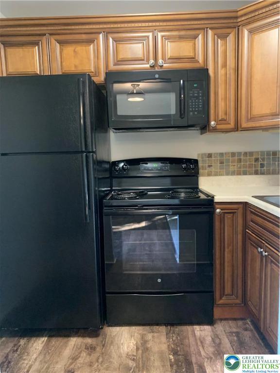 526 Broad Street, Unit 1 Emmaus, PA 18049 - Photo 7 of 15 a kitchen with stainless steel appliances granite countertop a refrigerator and a stove