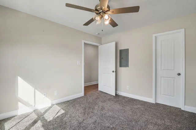 a view of a chandelier fan in a room