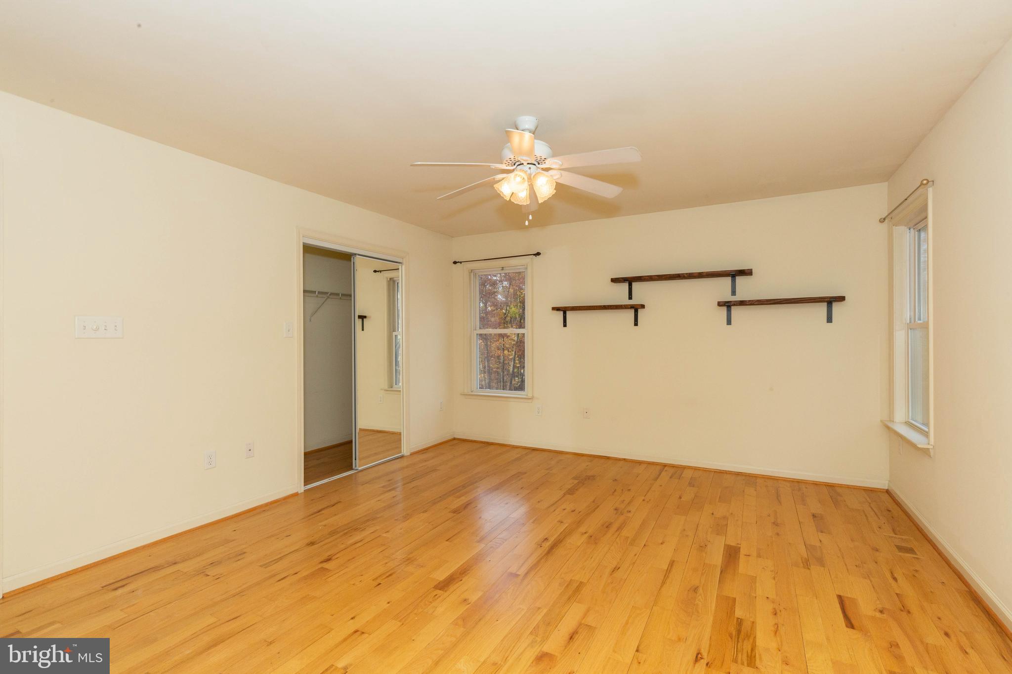 3311 Mission Road Harpers Ferry, WV 25425 - Photo 23 of 37 a view of a big room with wooden floor and a ceiling fan
