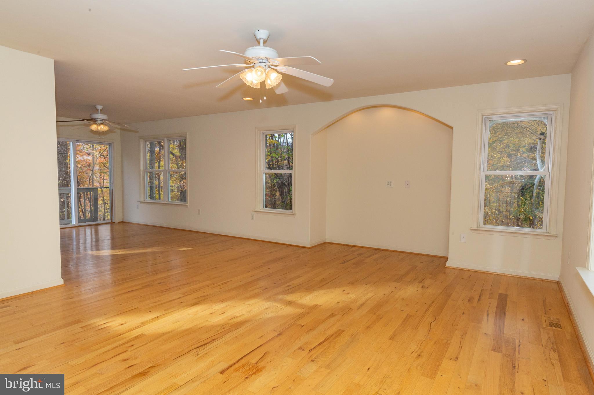 3311 Mission Road Harpers Ferry, WV 25425 - Photo 24 of 37 a view of an empty room with wooden floor and chandelier