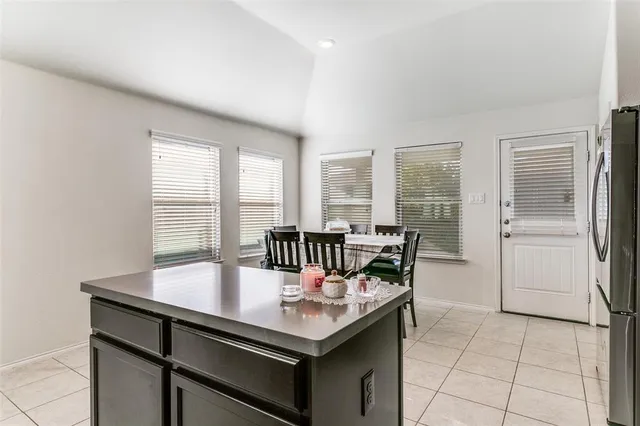 a view of a dining room with furniture and window
