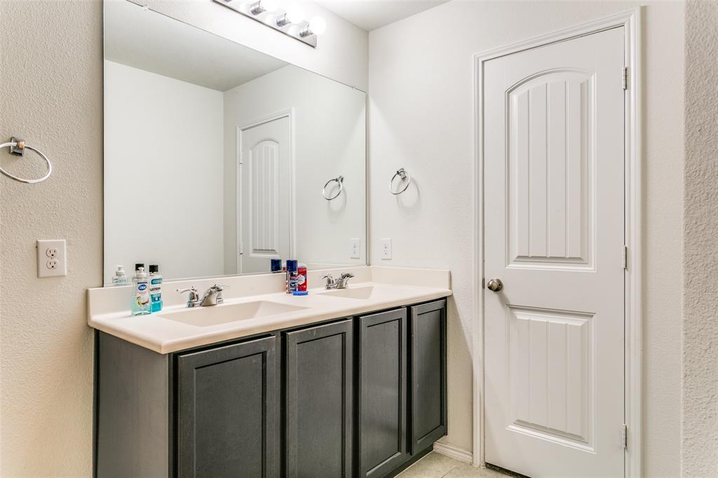 14549 Serrano Ridge Road Fort Worth, TX 76052 - Photo 18 of 25 a bathroom with a sink and a mirror