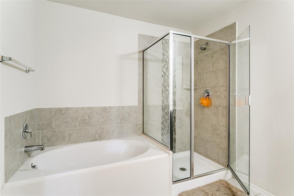 14549 Serrano Ridge Road Fort Worth, TX 76052 - Photo 19 of 25 a bathroom with a bathtub and a shower