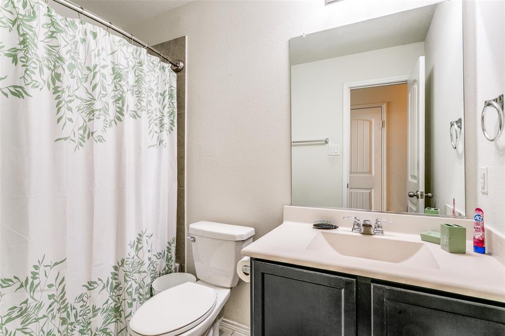 14549 Serrano Ridge Road Fort Worth, TX 76052 - Photo 21 of 25 a bathroom with a sink and a toilet