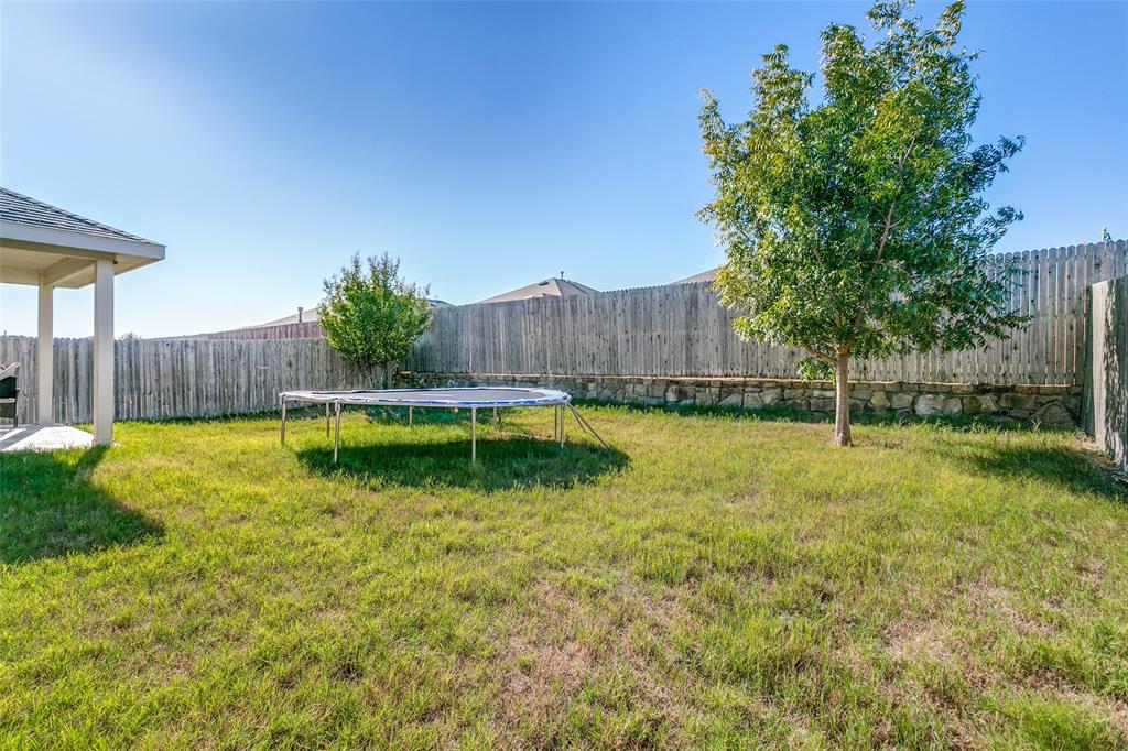 14549 Serrano Ridge Road Fort Worth, TX 76052 - Photo 24 of 25 a swimming pool with wooden fence