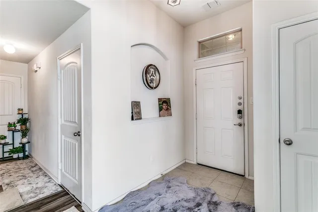 a view of an entryway with wooden floor