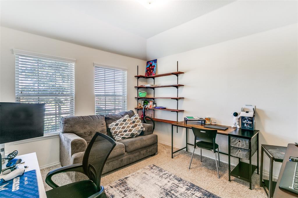 14549 Serrano Ridge Road Fort Worth, TX 76052 - Photo 9 of 25 a living room with furniture and a flat screen tv
