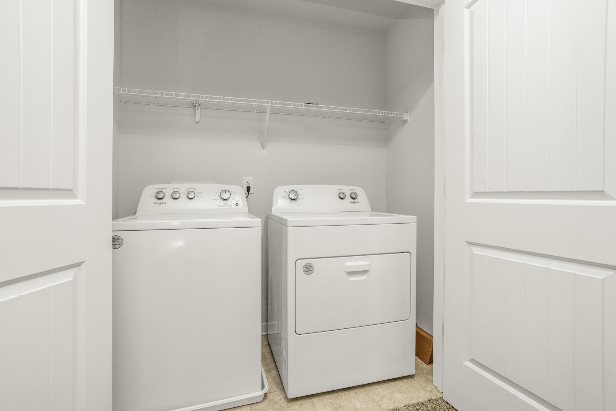 4221 Grapevine Loop Smyrna, TN 37167 - Photo 16 of 27 a utility room with dryer and washer