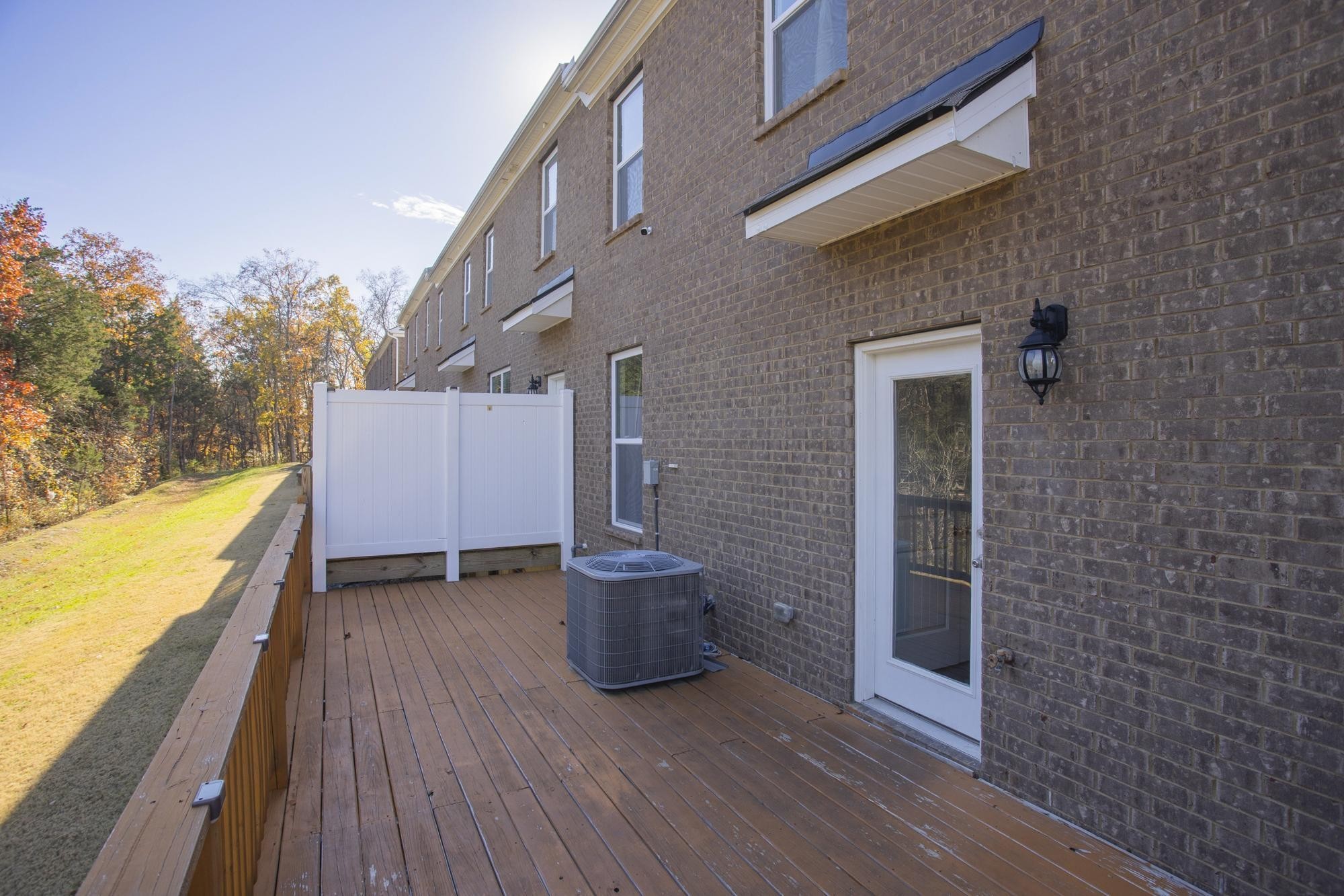 4221 Grapevine Loop Smyrna, TN 37167 - Photo 22 of 27 a view of an outdoor space with wooden floor and a yard