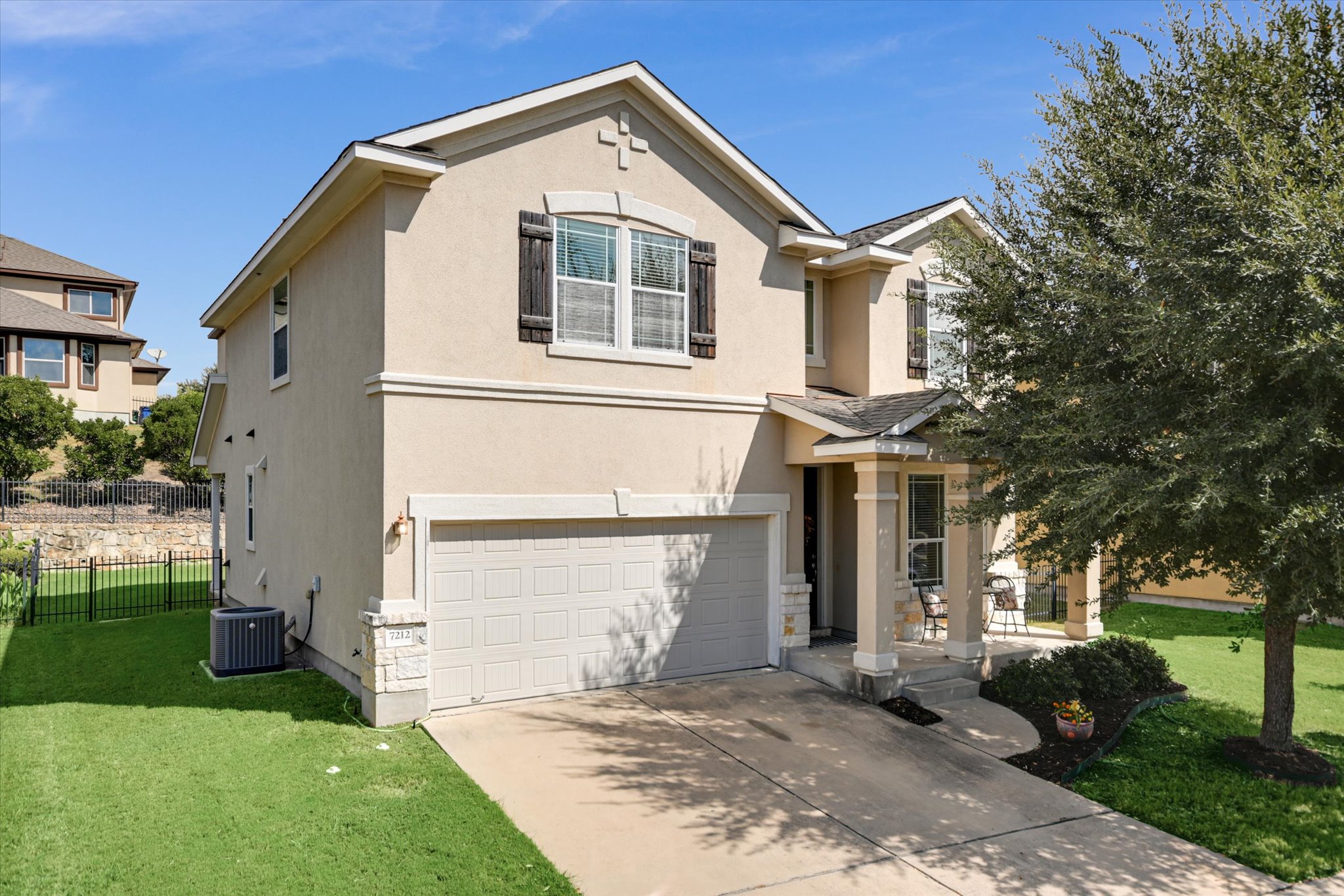 7212 Lookout Bluff Terrace, Unit D18 Austin, TX 78735 - Photo 2 of 22 a view of a house with a yard