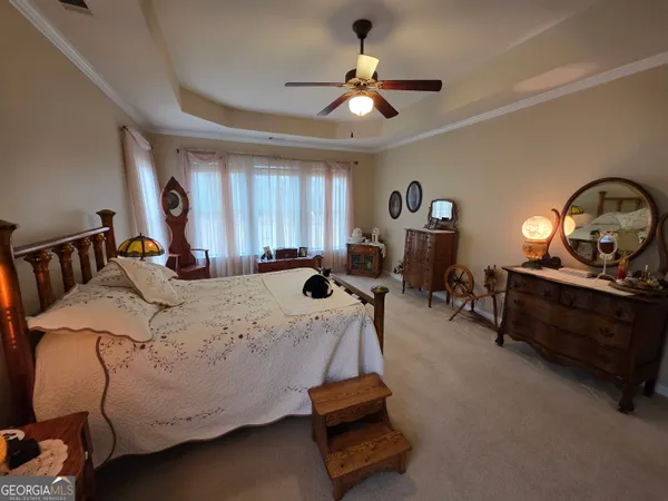 a bed room with a bed and a gym