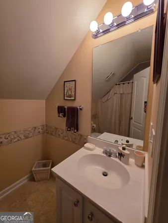 a bathroom with a sink and mirror