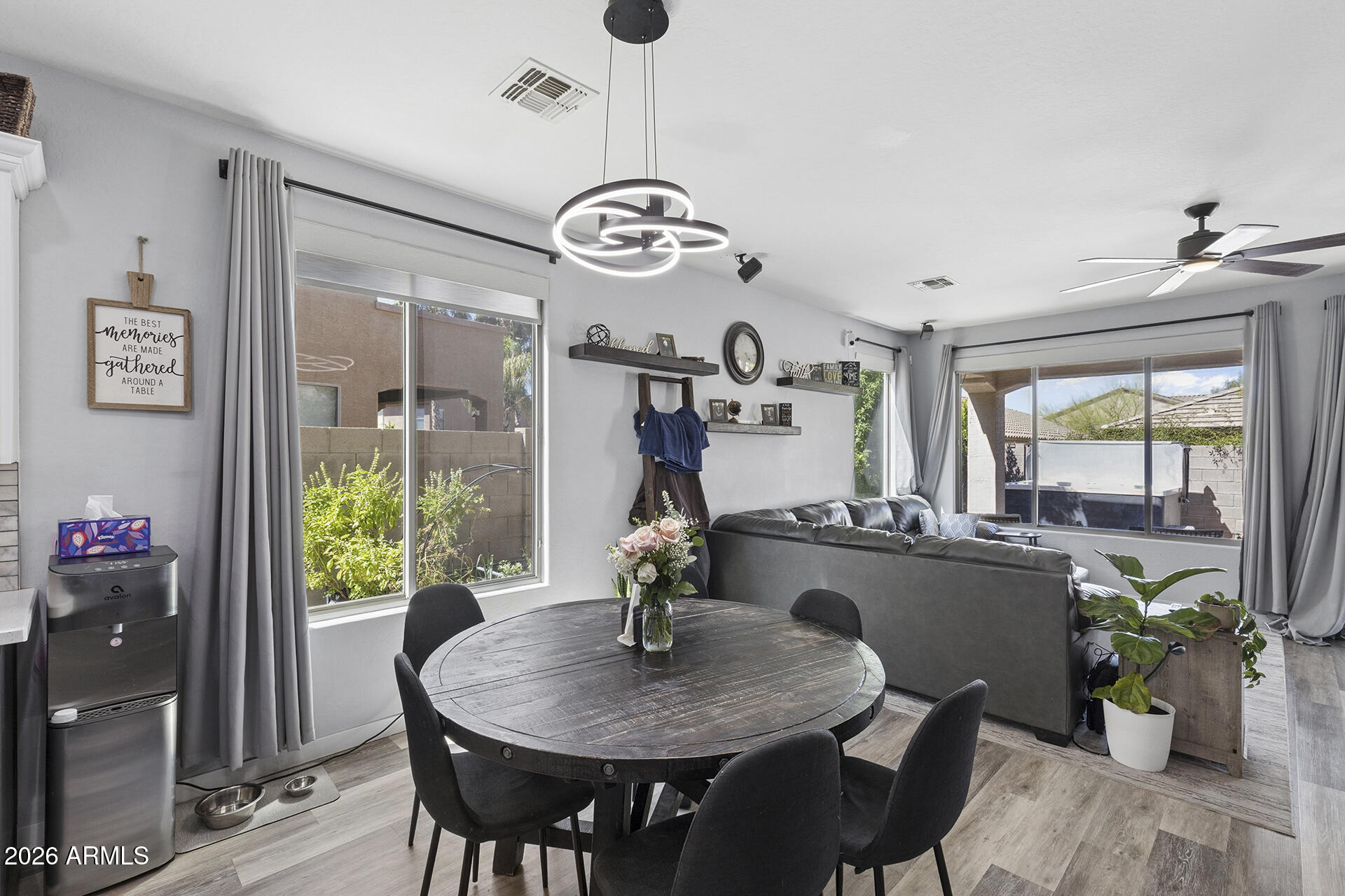6848 West Ridgeline Road Peoria, AZ 85383 - Photo 20 of 71 a view of a dining room with furniture window and wooden floor