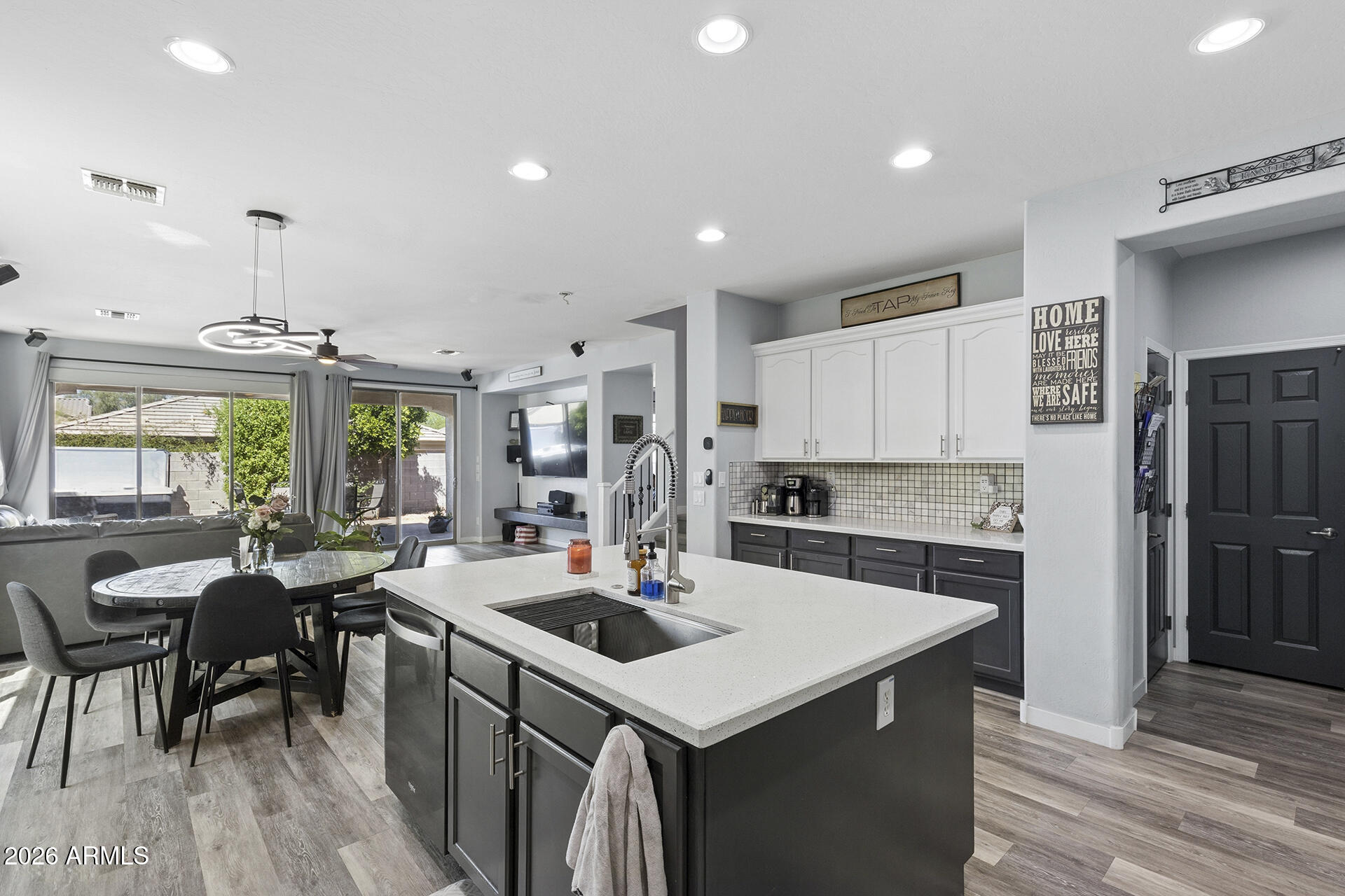 6848 West Ridgeline Road Peoria, AZ 85383 - Photo 21 of 71 a kitchen with a stove a table and chairs in it