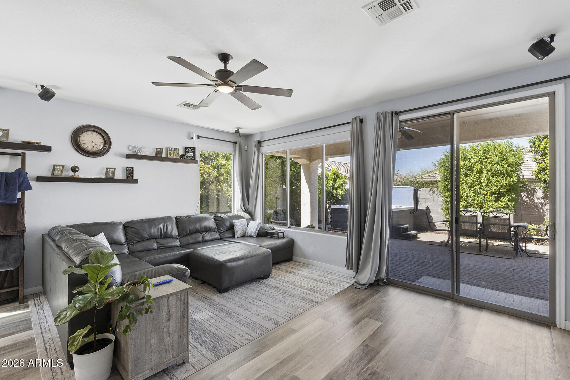6848 West Ridgeline Road Peoria, AZ 85383 - Photo 23 of 71 a living room with furniture and a large window