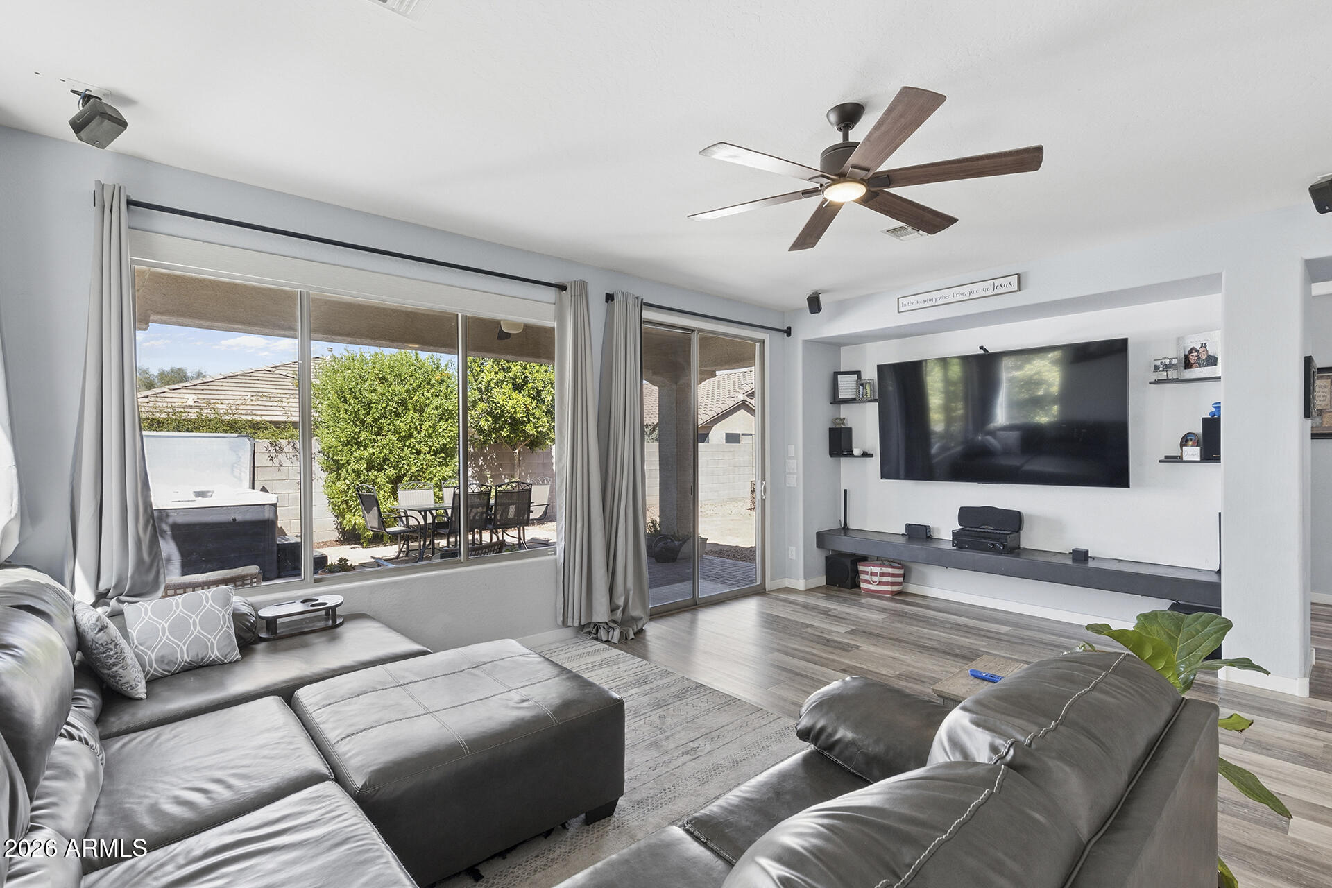 6848 West Ridgeline Road Peoria, AZ 85383 - Photo 25 of 71 a living room with furniture and a flat screen tv
