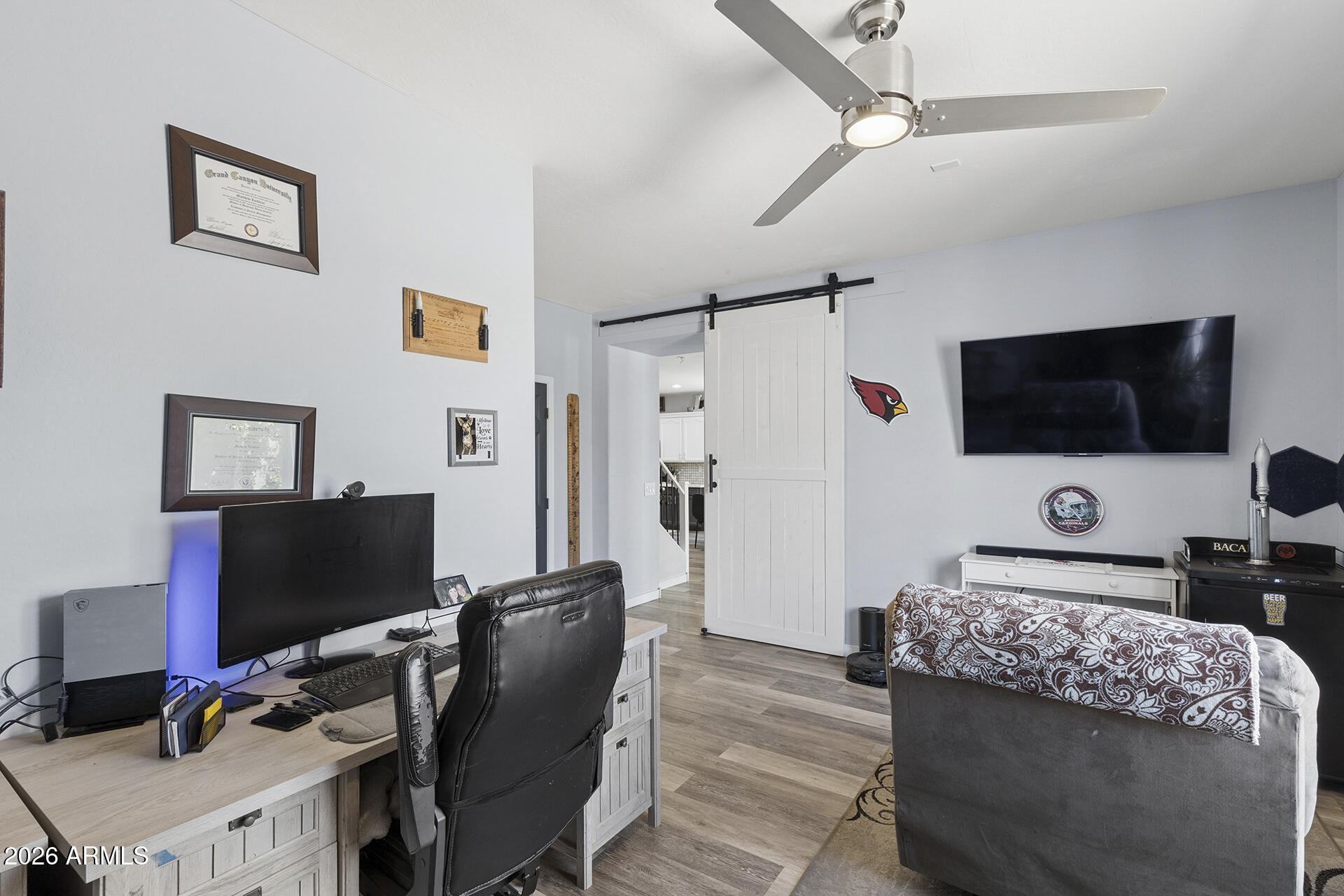 6848 West Ridgeline Road Peoria, AZ 85383 - Photo 33 of 71 a living room with furniture and a flat screen tv