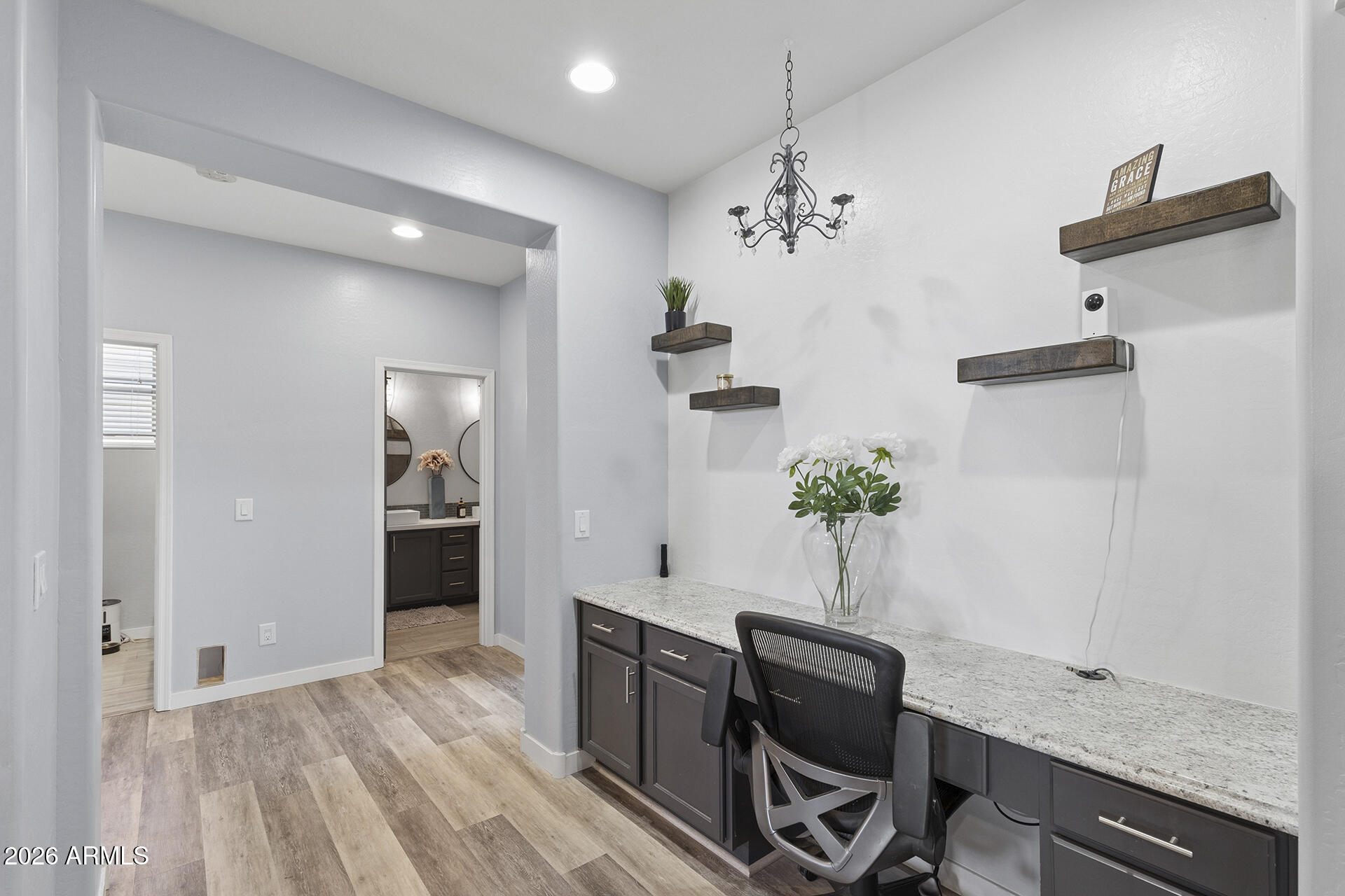 6848 West Ridgeline Road Peoria, AZ 85383 - Photo 37 of 71 a view of a workspace with furniture and wooden floor