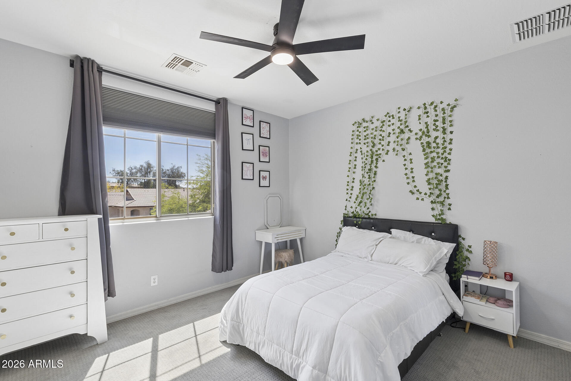 6848 West Ridgeline Road Peoria, AZ 85383 - Photo 41 of 71 a bedroom with a bed and a dresser