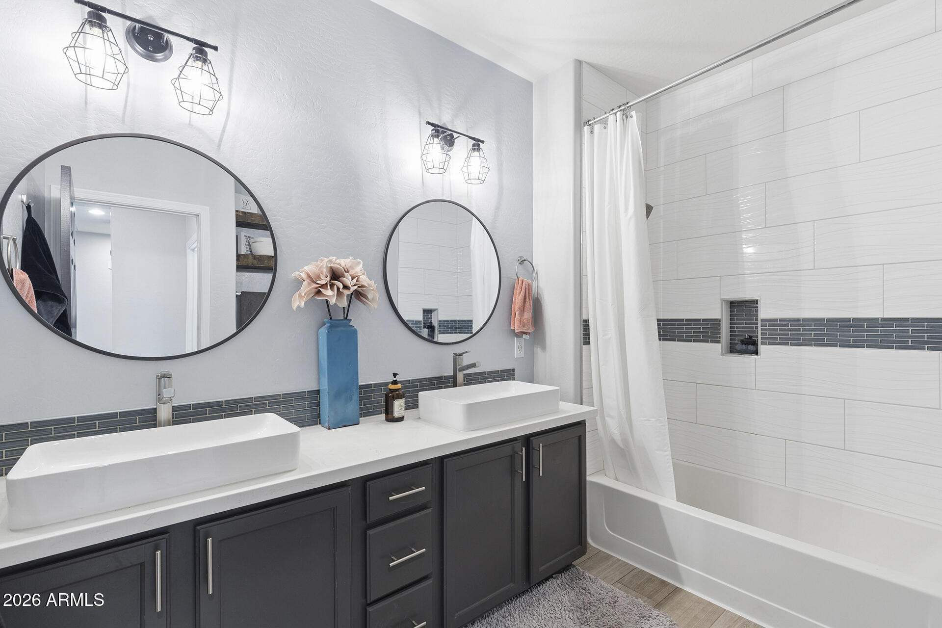 6848 West Ridgeline Road Peoria, AZ 85383 - Photo 43 of 71 a bathroom with a double vanity sink mirror and shower