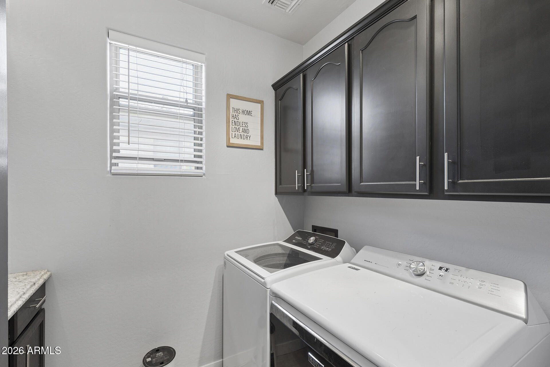6848 West Ridgeline Road Peoria, AZ 85383 - Photo 45 of 71 a bathroom with a sink and a washer dryer