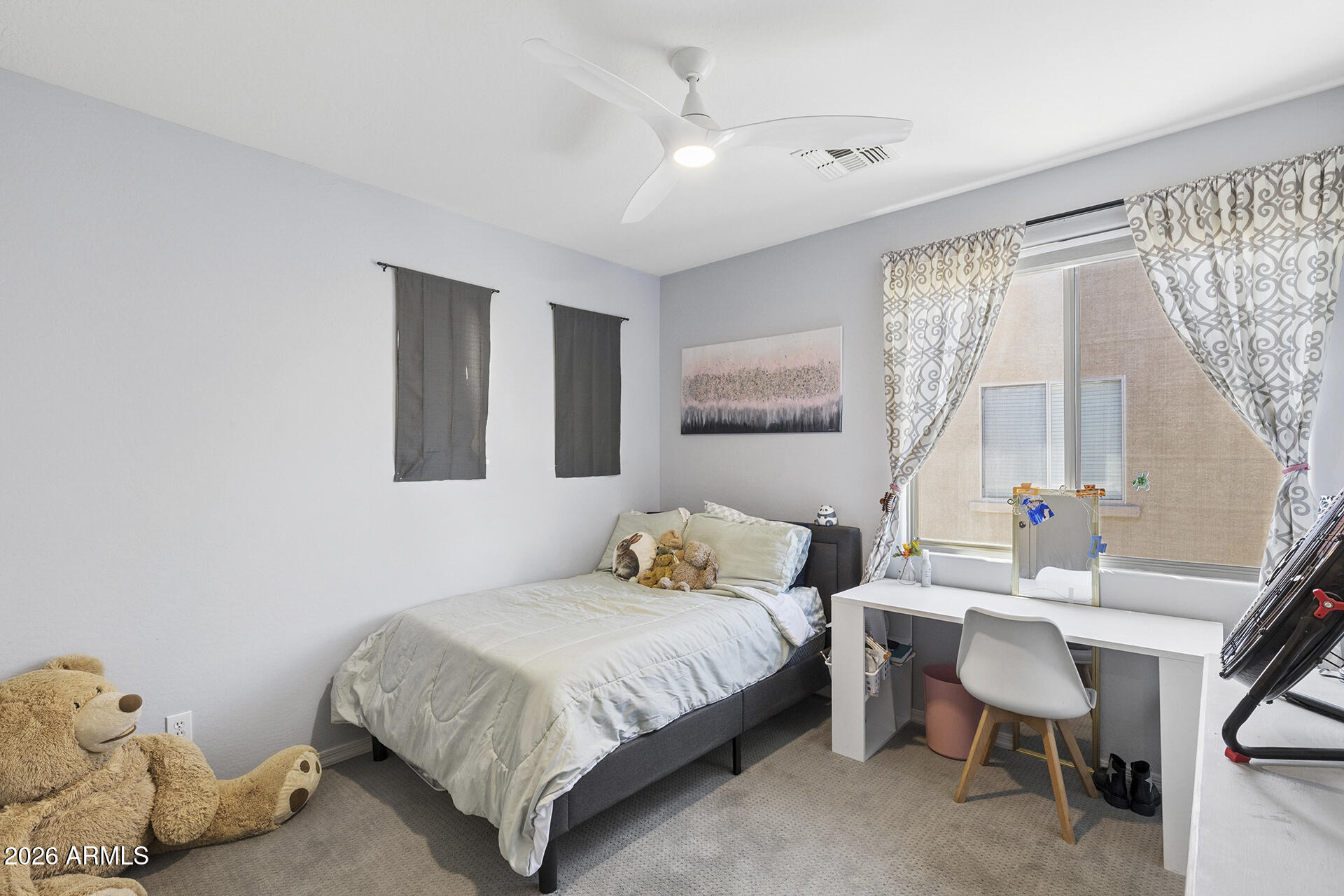 6848 West Ridgeline Road Peoria, AZ 85383 - Photo 48 of 71 a bedroom with a bed and a window