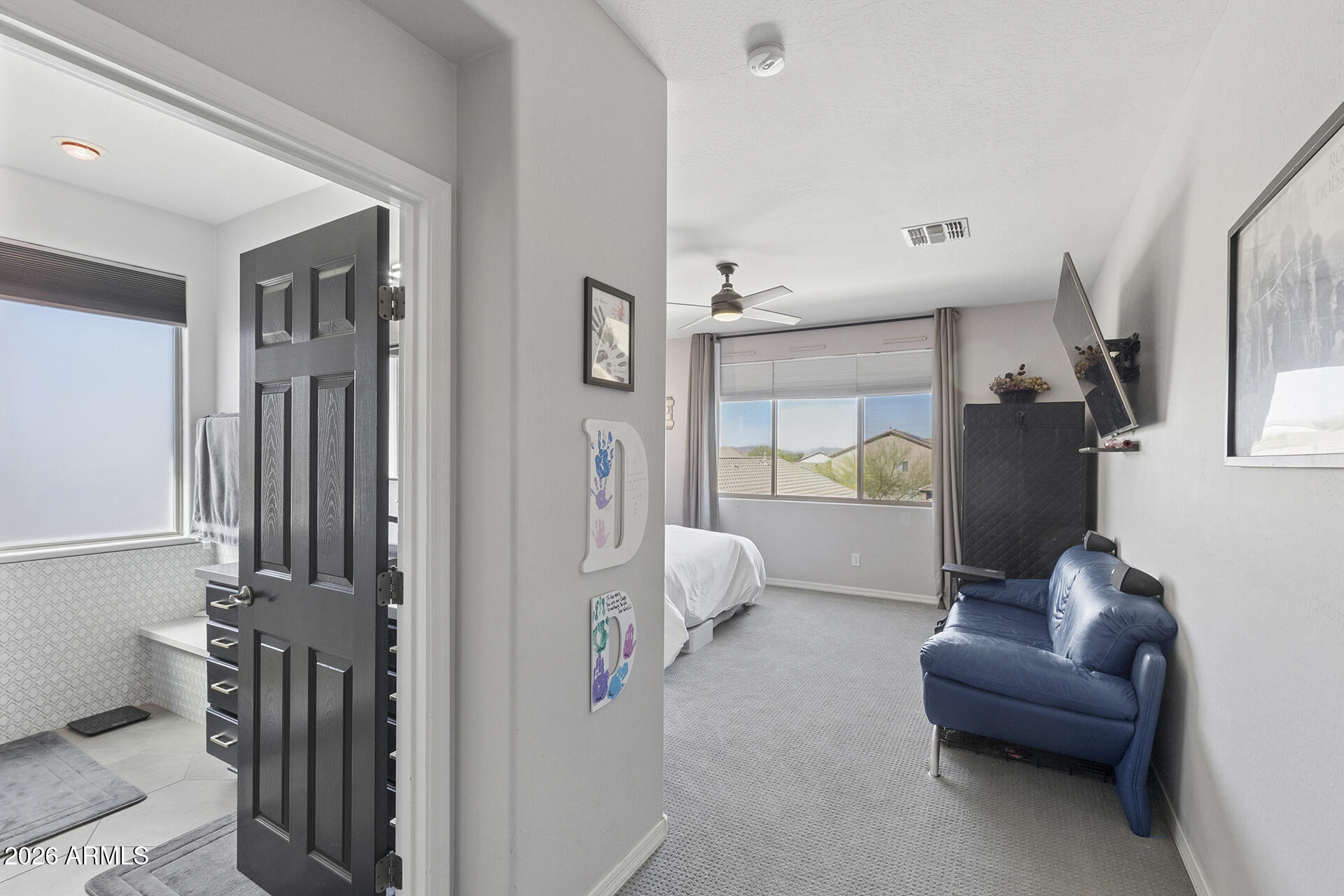 6848 West Ridgeline Road Peoria, AZ 85383 - Photo 50 of 71 a living room with furniture and a wooden floor