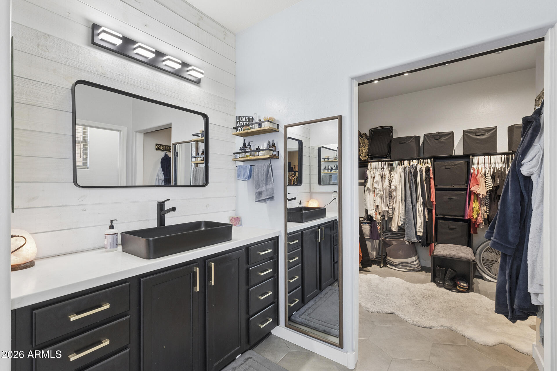 6848 West Ridgeline Road Peoria, AZ 85383 - Photo 54 of 71 a spacious bathroom with a double vanity sink and a mirror