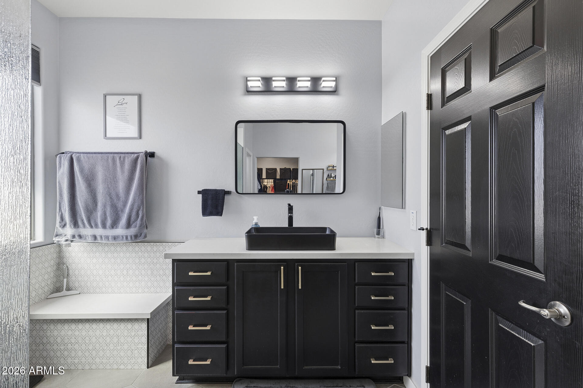 6848 West Ridgeline Road Peoria, AZ 85383 - Photo 59 of 71 a bathroom with a sink and a mirror
