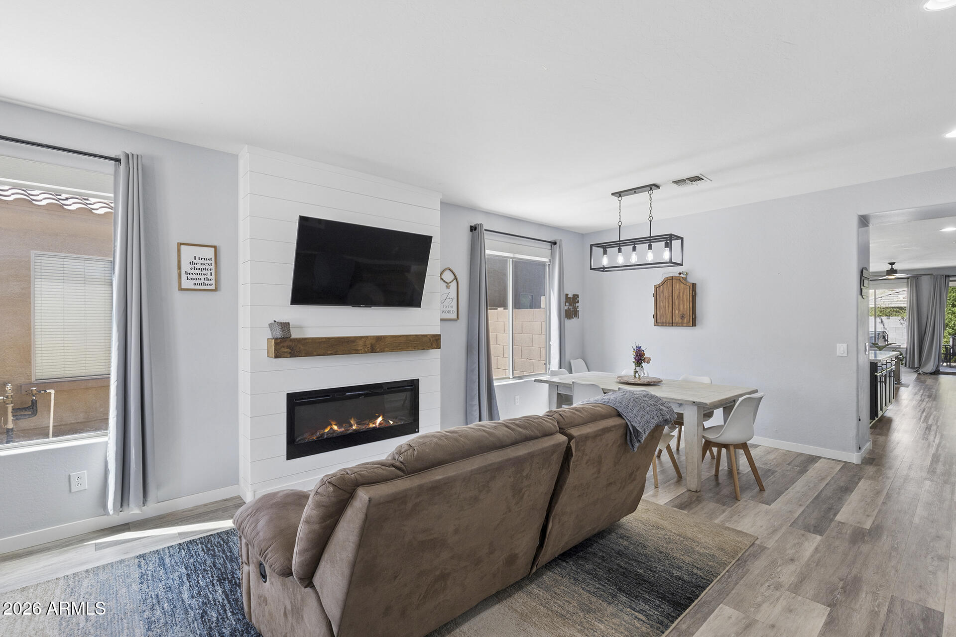 6848 West Ridgeline Road Peoria, AZ 85383 - Photo 6 of 71 a living room with furniture fireplace and flat screen tv