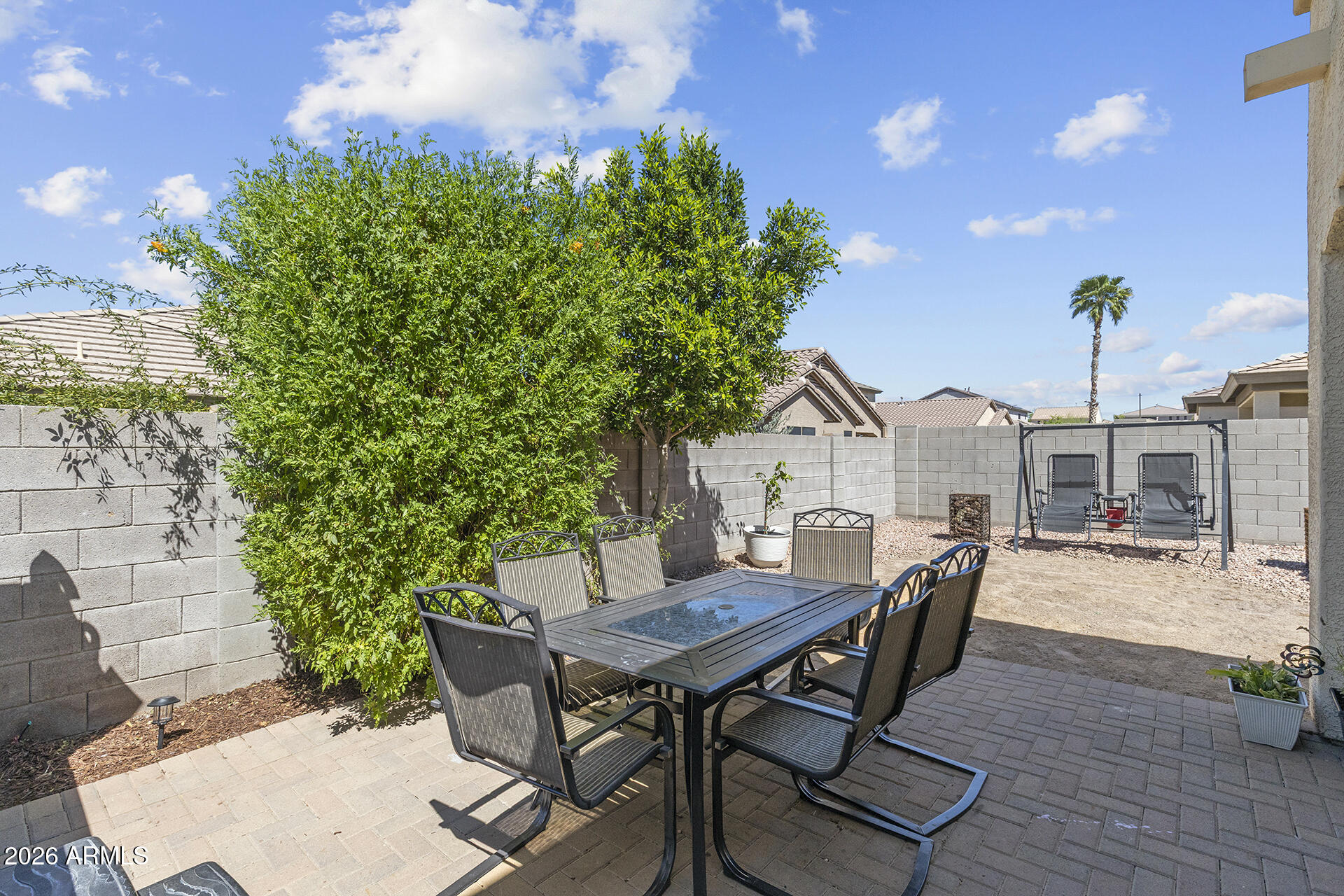 6848 West Ridgeline Road Peoria, AZ 85383 - Photo 64 of 71 a view of a dinning table and chairs in the patio